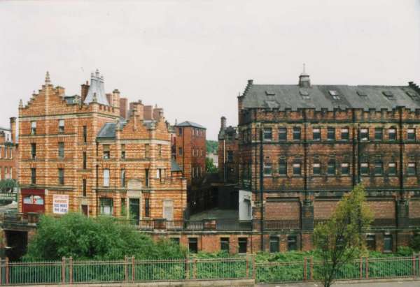 View from (foreground) Castlegate showing (left) Royal Victoria Buildings and (right) Hancock and Lant Ltd., wholesale furniture and carpet dealers