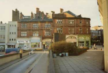Norfolk Street from Town Hall extension showing (l. to r.) Nos. 188/90 G.M.B.Union offices; 186 Mumtaz restaurant; 184, Beds Galore; 178 Vernons, bakers; 176 Hearing Aid Services; 174 Sheffield Health Food Store and 172 Army and General Stores Ltd.