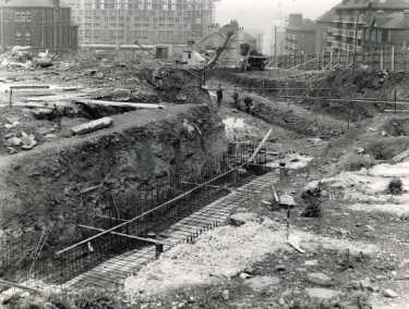 Park Hill Redevelopment Area, Part 1: [Park Hill Flats construction]. Block D. Foundations showing (top right) Bard Street Flats on Duke Street Duke Street shops and community centre