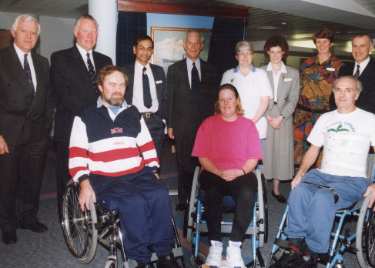 Sir John Osborn (1922 - 2015) MP (fourth left standing): unidentified visit