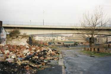 Blast Lane looking towards the Parkway and Parkway supertram bridge showing (left) demolished premises of Frank Cobb and Co. Ltd., silversmiths, Howard Works, Nos. 57 - 67 Broad Street