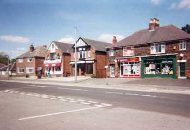 Nos. 26 - 20 (l. to r.) Hutcliffe Wood Road showing No. 22 Figaro's, hairdressers