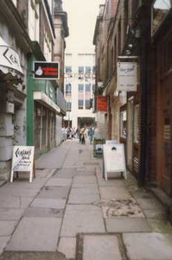 Shops on High Court showing (left) Caesars Hair and No. 8a Rebina Shoes