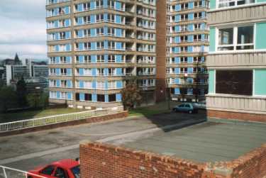 Claywood Flats showing view over garages to Norfolk tower block