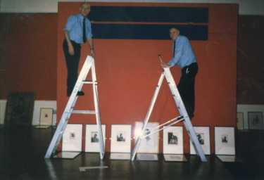 Hanging the 'Brockhurst' exhibition, Graves Art Gallery, Surrey Street showing Bill Robinson and Harry [?Syring]