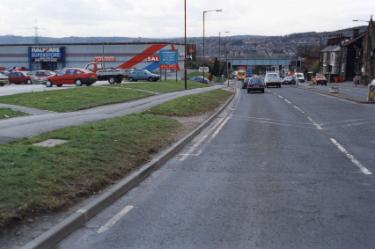 Halifax Road looking towards Halifax Road railway bridge and showing (left) Halfords superstore, Unit C, Kilner Way