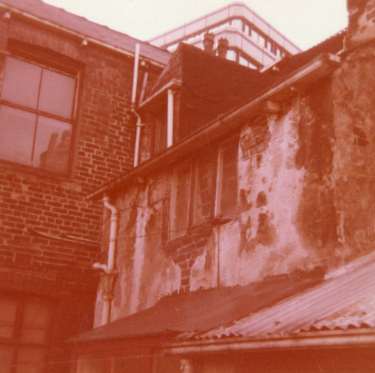 Rear of buildings on Orchard Street, before development of Orchard Square