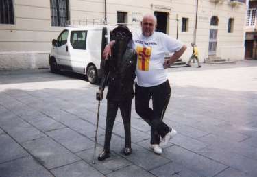 Ron Clayton in Pontevedra, Spain alongside a statue of Ramon del Valle-Inclan, Spanish author and dramatist