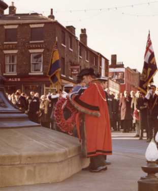 Lord Mayor, Alderman Harold Hebblethwaite lays a wreath at the Armistice Day commemorations, Barkers Pool looking towards (centre) Division Street 