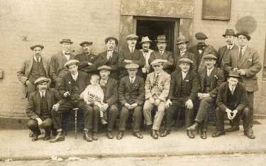 Group outside beerhouse at No. 78 Macro Street