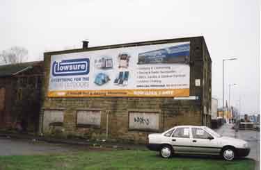 Advertisement on old forge on Livesey Street at junction with (right) Penistone Road