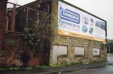 Advertisement on old forge on Livesey Street at junction with (right) Penistone Road