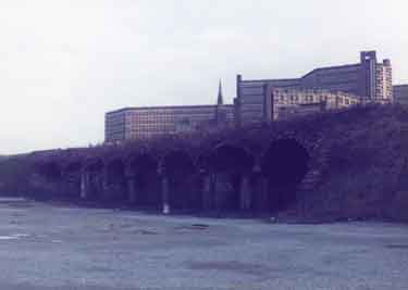 Hyde Park Flats from railway arches at the Canal Basin