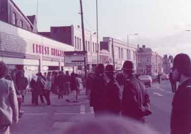 Police and crowds on Attercliffe Road showing (left) Nos. 614 - 618 Ernest Burgess Ltd., tailors