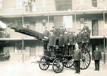 Group of firemen including Superintendant William Frost with a horse drawn fire engine outside Rockingham Street Fire Station showing (back) Firemans flats