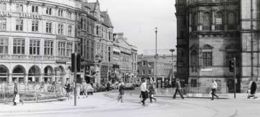 Surrey Street (centre) at the junction of (left) Fargate and (right) Pinstone Street showing (left) Yorkshire Bank and the Goodwin Fountain