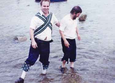 Sheffield City Morris members in the River Wharfe at Burnsall, North Yorkshire