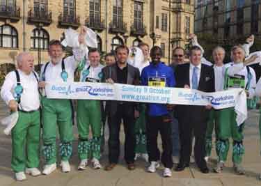 Sheffield City Morris in the Peace Gardens with Micah Kogo of Kenya, winner of the Great Yorkshire Run, 2011 dancing in the Peace Gardens at their 40th Anniversary celebrations