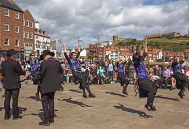Friends of Sheffield City Morris. Mortimers Morris from Nottingham performing at Whitby, North Yorkshire
