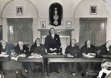 Unidentified group of men in a meeting