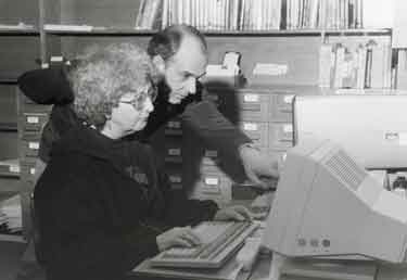 Librarians Penny Sunderland and Terry Whitham using the Dynix compter system, Central Library, Surrey Street