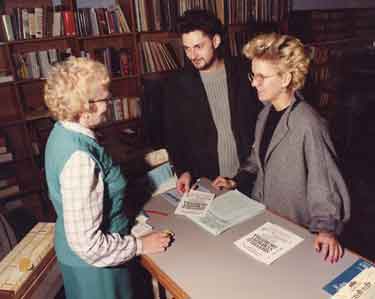 Eileen Eastwood (left) serving in the Music and Video Library, Central Library, Surrey Street