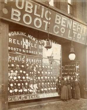 Shop assistants outside Public Benefit Boot Co. Ltd., shoe and boot manufacturers and retailers, Moorhead