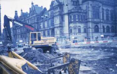 Goodwin Fountain being filled in at the top of Fargate showing (left) Surrey Street and (back) Town Hall
