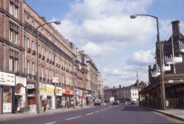 Shops on Pinstone Street looking towards Leopold Street showing (right) the wood constructed bus shelters
