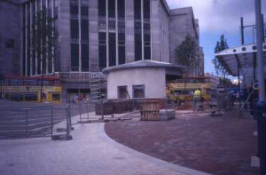 Construction of Castle Square and the Supertram stop following the filling in of the Hole in the Road showing (top left) House of Fraser, department store