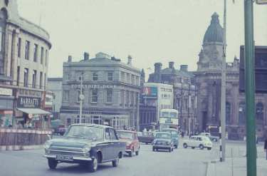 High Street looking towards Commercial Street and the junctions with (right) Fitzalan Square showing (centre left) Yorkshire Bank, Nos. 2 - 4 Haymarket and (top right) Barclays Bank, corner of High Street and Fitzalan Square