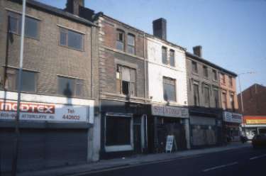 Derelict shops on Attercliffe Road showing Nos. 605 - 607 Modtex and No. 615 Shenton and Co., carpet and suite showroom looking towards the junction of Shortridge Street