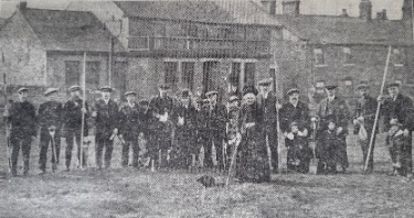 Formal opening of Warren Association allotments at Chapeltown.  A lady cuts the first sod of the selected ground.