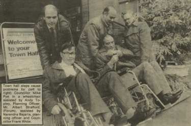 Group on the Town Hall steps, [Pinstone Street] highlighting the access problems for people with disabilities