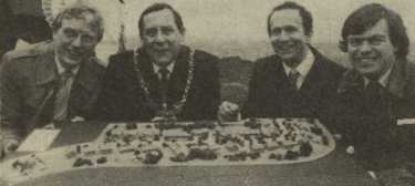Group examining an architects model of a new housing scheme at Holgate Road