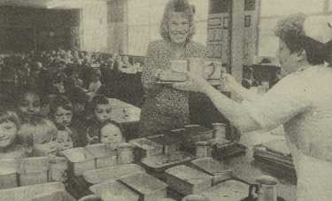 Author, Christine Rodgers, helping to serve meals at Southey Green School, Crowder Avenue