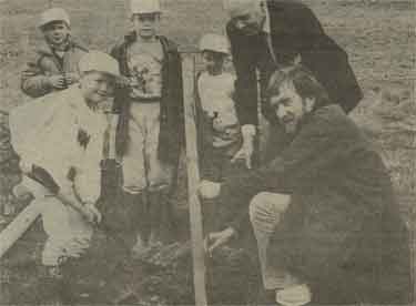 Countryside Officer, Geoff Cartwright, has a watchful eye on youngsters helping with Stocksbridge Engineering Steel's ambitious 5 year plan to 'green' 40 acres of its land with at least 100,000 trees and wildflower meadows