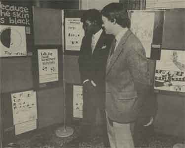 Sheffield Wednesday's David Bennett inspects an exhibition of children's drawings with Council Leader, Clive Betts at the launch of 'Because the Skin is Black'