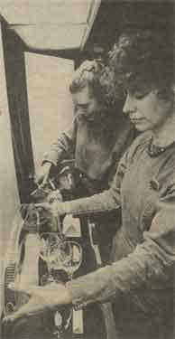 Ann Lockey and Claire Harrington arranging a display of gifts on sale at the Town Hall