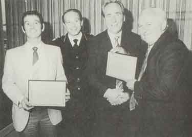 The chair of the South Yorkshire County Fire and Civil Defence Authority, Fire Service Committee, Councillor Rigby and the chief fire officer H.E. Wright present awards to Trevor Vigrass and Donald Hall