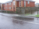 View: a00276 Flooding on Nether Lane, Ecclesfield. Water flowing out of football field next to Nightingale Residential Home