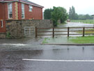 View: a00277 Flooding on Nether Lane, Ecclesfield. Water flowing out of football field next to Nightingale Residential  Home