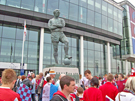 Sheffield United and Burnley fans mingle around the statue of Bobby Moore before the Championship play-off final at Wembley Stadium