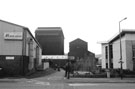 View: c01092 AR Motor Co. Ltd. (left) and The Five Weirs Walk entrance over the footbridge, Bold Street from Amberley Street looking across the River Don towards the former Gun Shop of River Don Works
