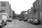 View: c01202 Effingham Street with The Tempered Spring Co. Ltd., Spring Works (left) and Cromwell Tools, Waverley House, Waverley Works (right) formerly occupied by Henry Rossell and Co Ltd, looking towards Norfolk Midland Railway Bridge