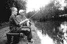 Shane Budd and son Jake fishing in the Canal (Sheffield and South Yorkshire Navigation) near near Pothouse Bridge, Coleridge Road
