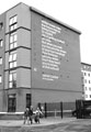 View: c01842 Poem entitled Trashed on Cider by Jarvis Cocker, commissioned by Off the Shelf Festival, on the wall of The Forge, Sheffield Hallam University Student accommodation, Boston Street