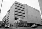 View: c01943 John Lewis (formerly Cole Brothers), department store, at the junction of Cross Burgess Street (left) and Burgess Street (right) with the multi storey car park above