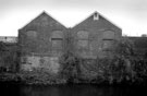 View from Five Weirs Walk over the River Don towards the rear of buildings on Liverpool Street
