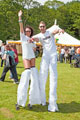 Two people on stilts in Endcliffe Park during Gay Pride Festival
